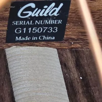 G1150733 serial label with Made in China wording inside a Guild D150NAT