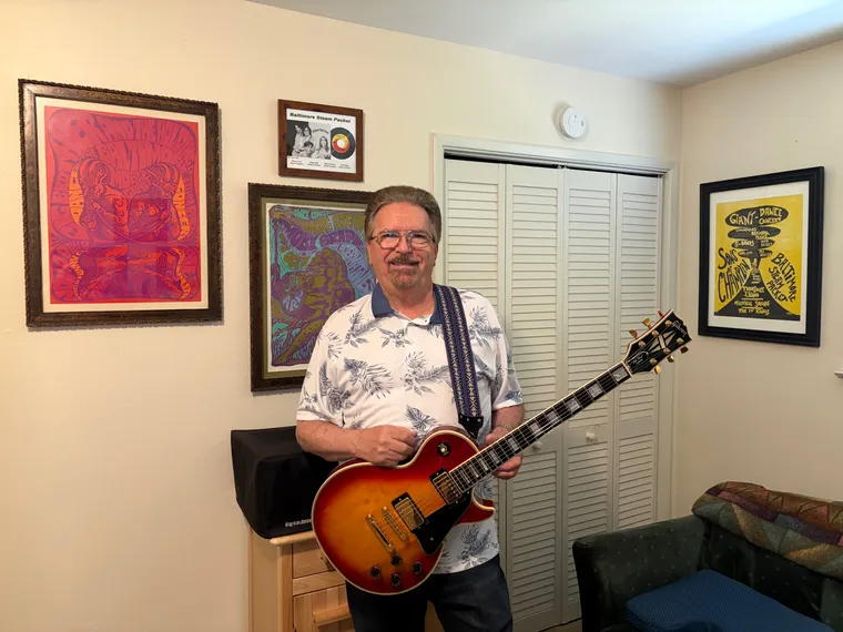 Dennis Hiatt later in life holding his one owner 1983 Gibson Les Paul Custom