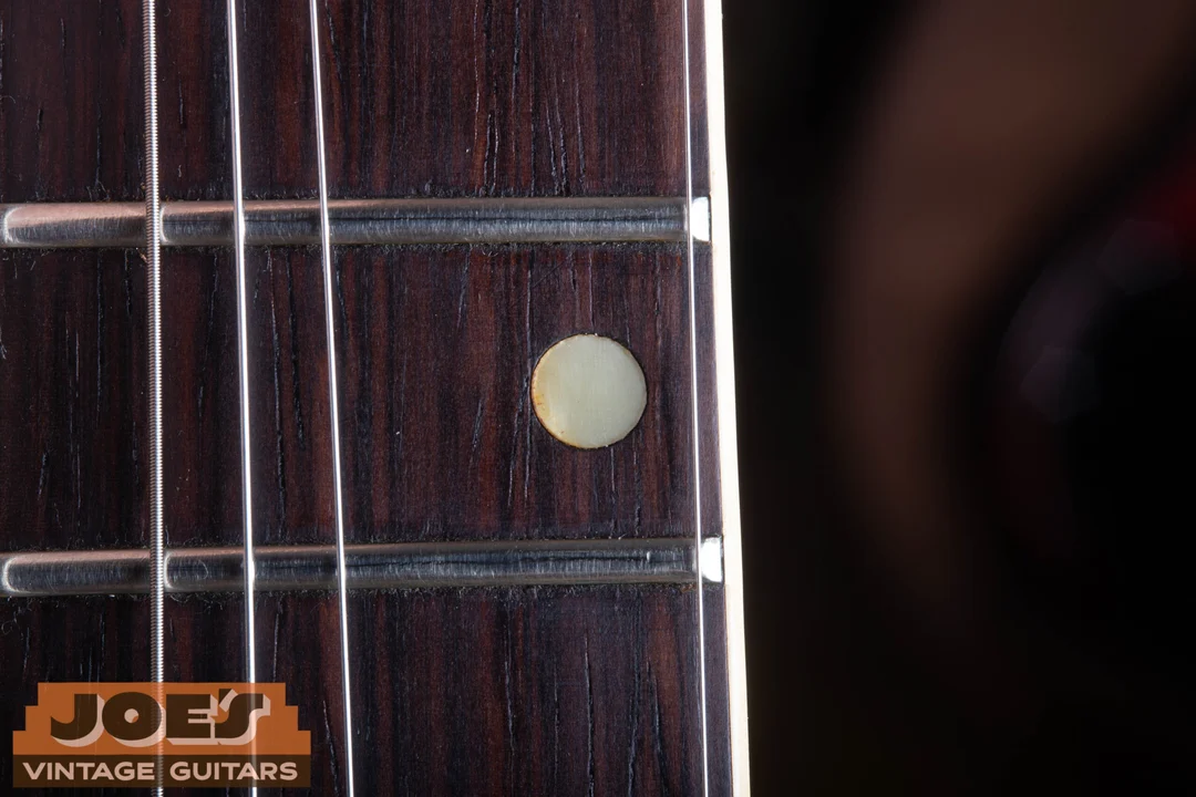 Round dot inlay and bound rosewood fingerboard on an early ES-330