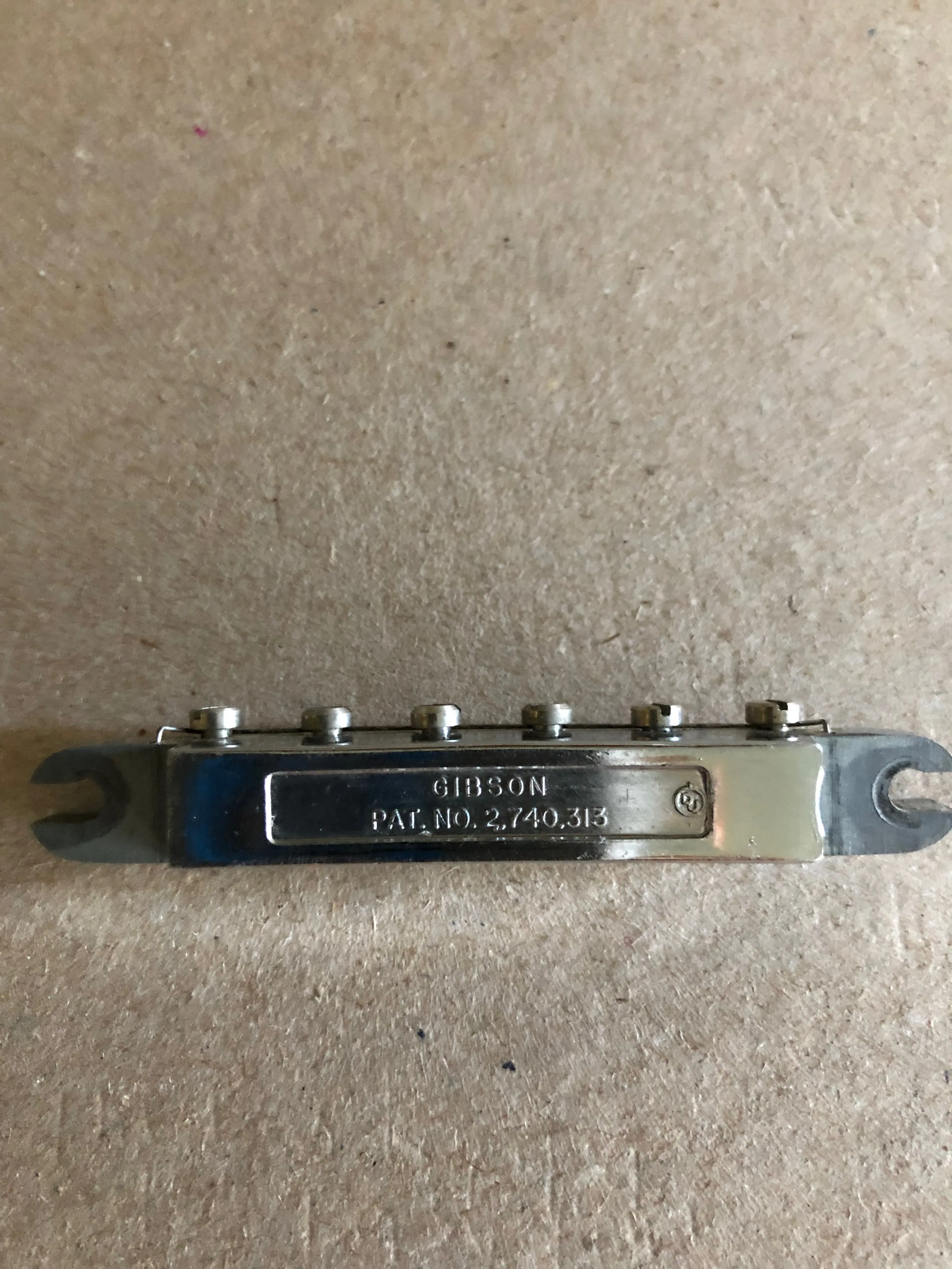 Reverse of the Dove Tune-o-matic assembly showing Gibson and patent markings