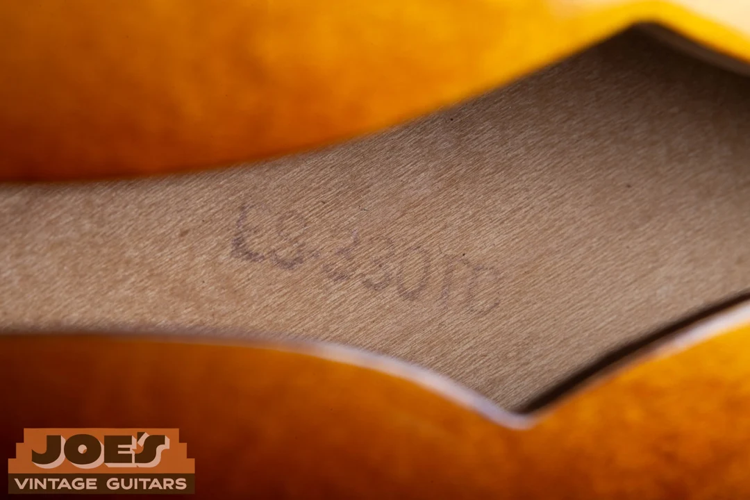 Faint ES-330TD model designation stamped directly onto wood inside the guitar