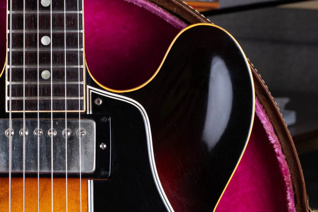 Dot inlays and a broad rounded cutaway on an early sunburst Gibson ES-335