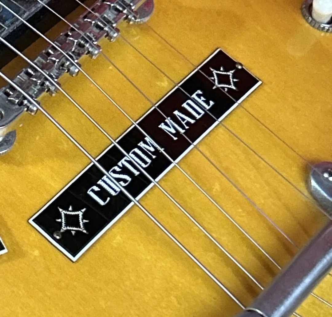 Gibson Custom Made plaque covering stopbar stud positions on a vintage ES guitar