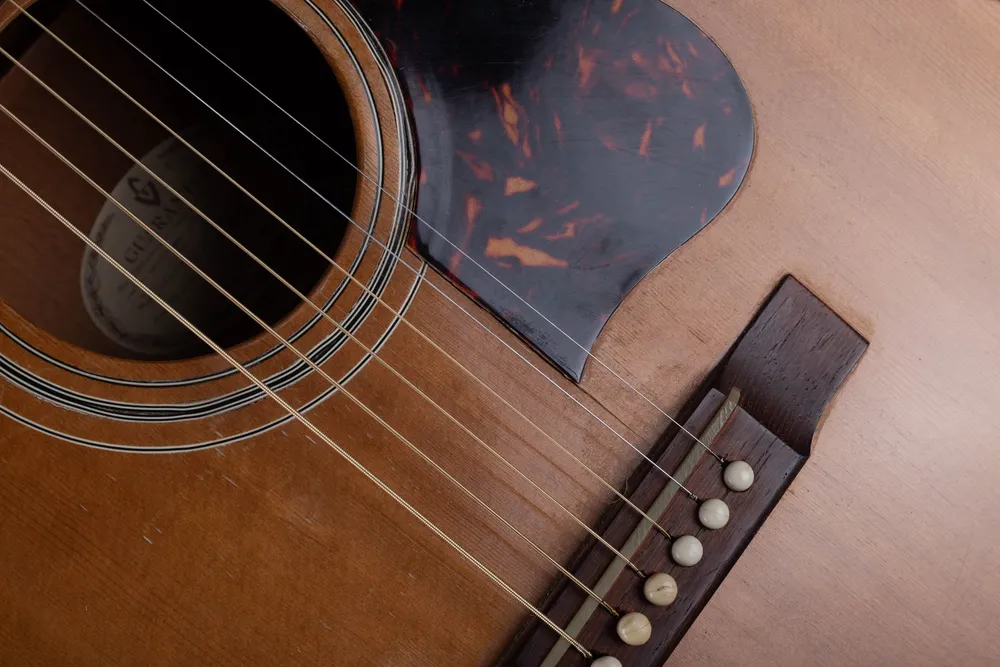 Guild F30 bridge and worn pickguard area