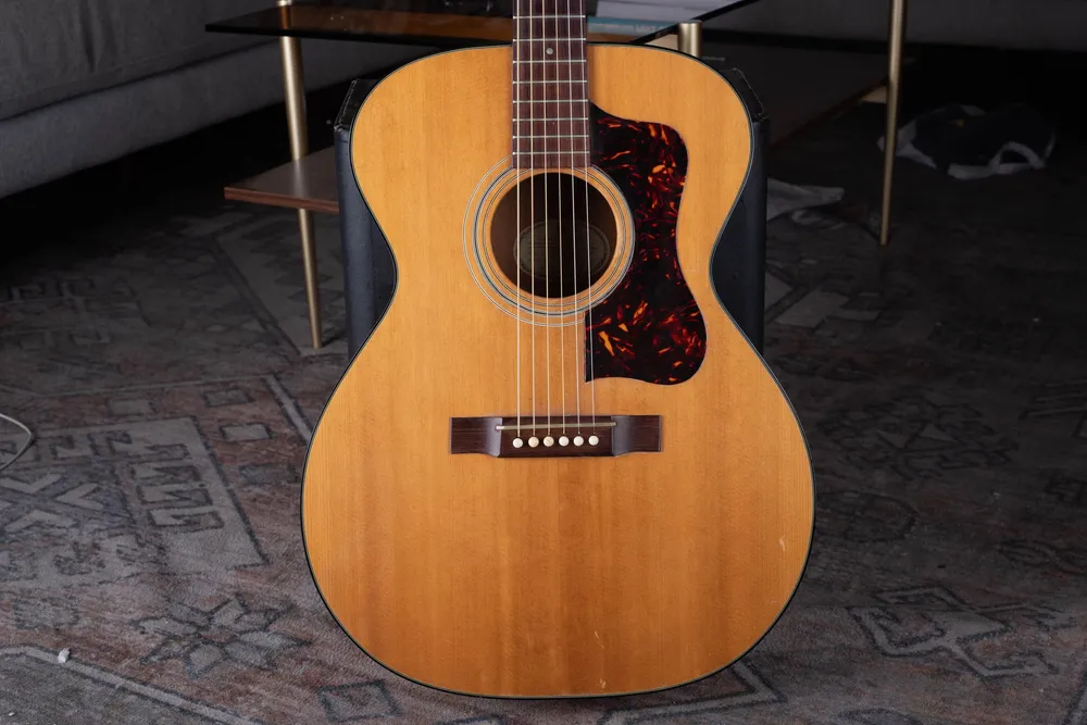 Front view of a Guild F30 acoustic with tortoiseshell-pattern pickguard