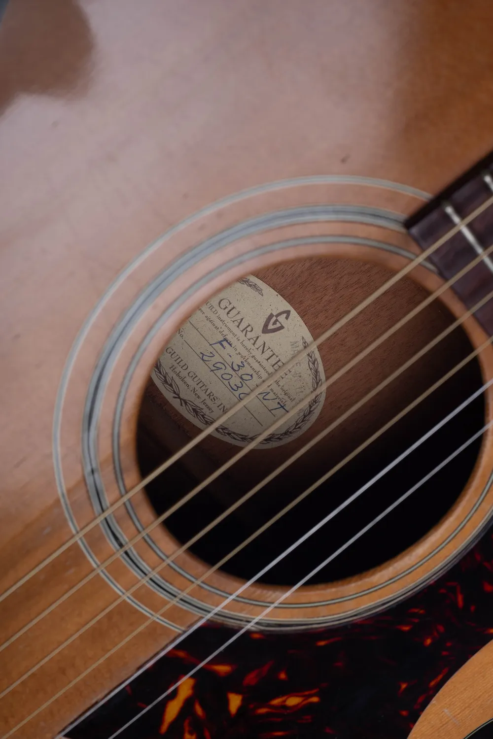 Guild F30 label with handwritten serial 29030
