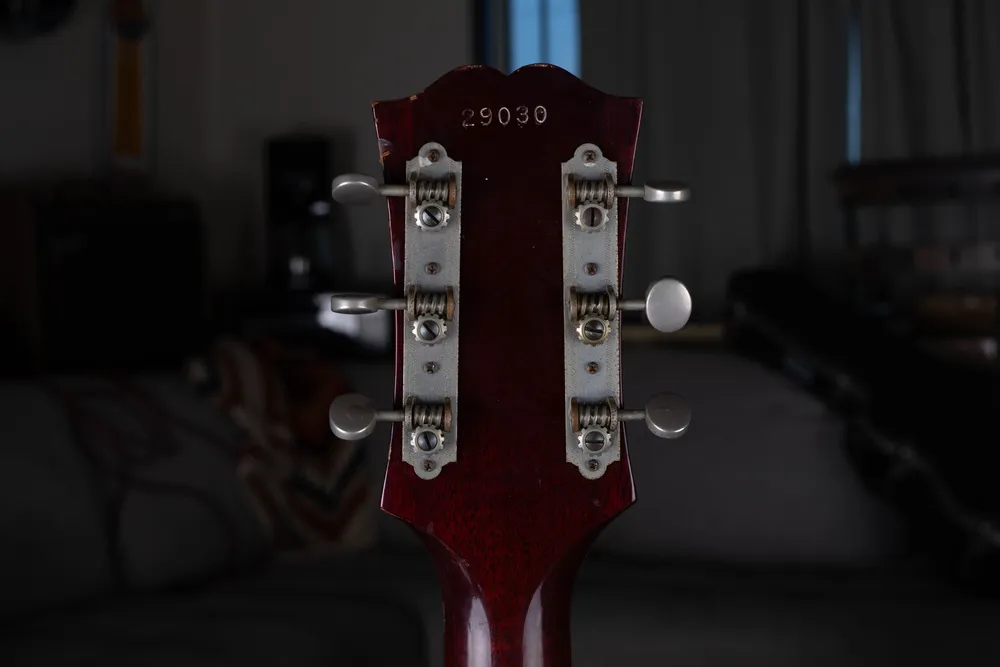Guild F30 rear headstock stamped 29030 above open-gear tuners