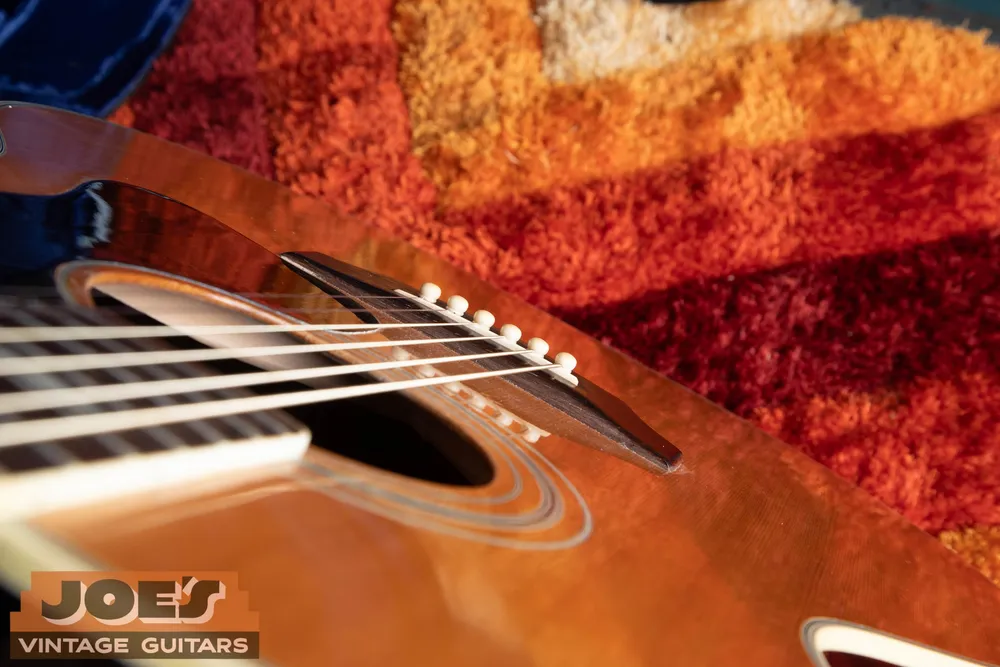 Low-angle view across the Guild F48 acoustic bridge