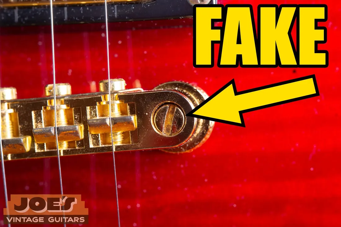 Large slotted bridge post on a fake Gibson guitar