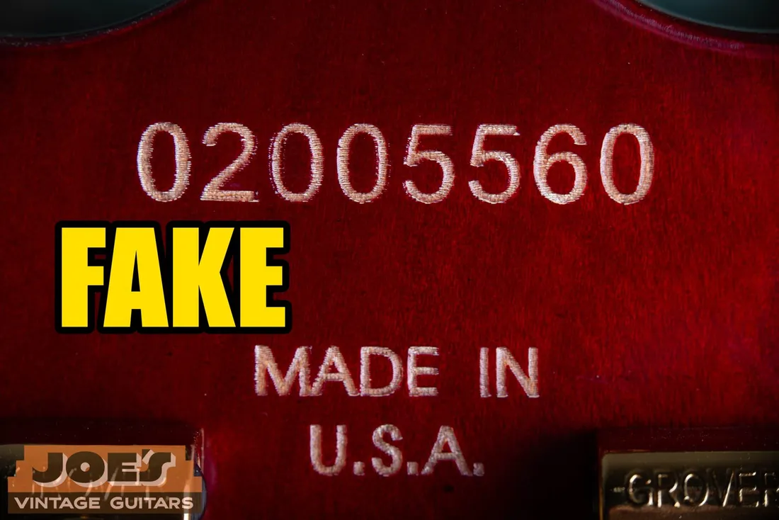 Laser-etched serial number on a fake Gibson-style headstock