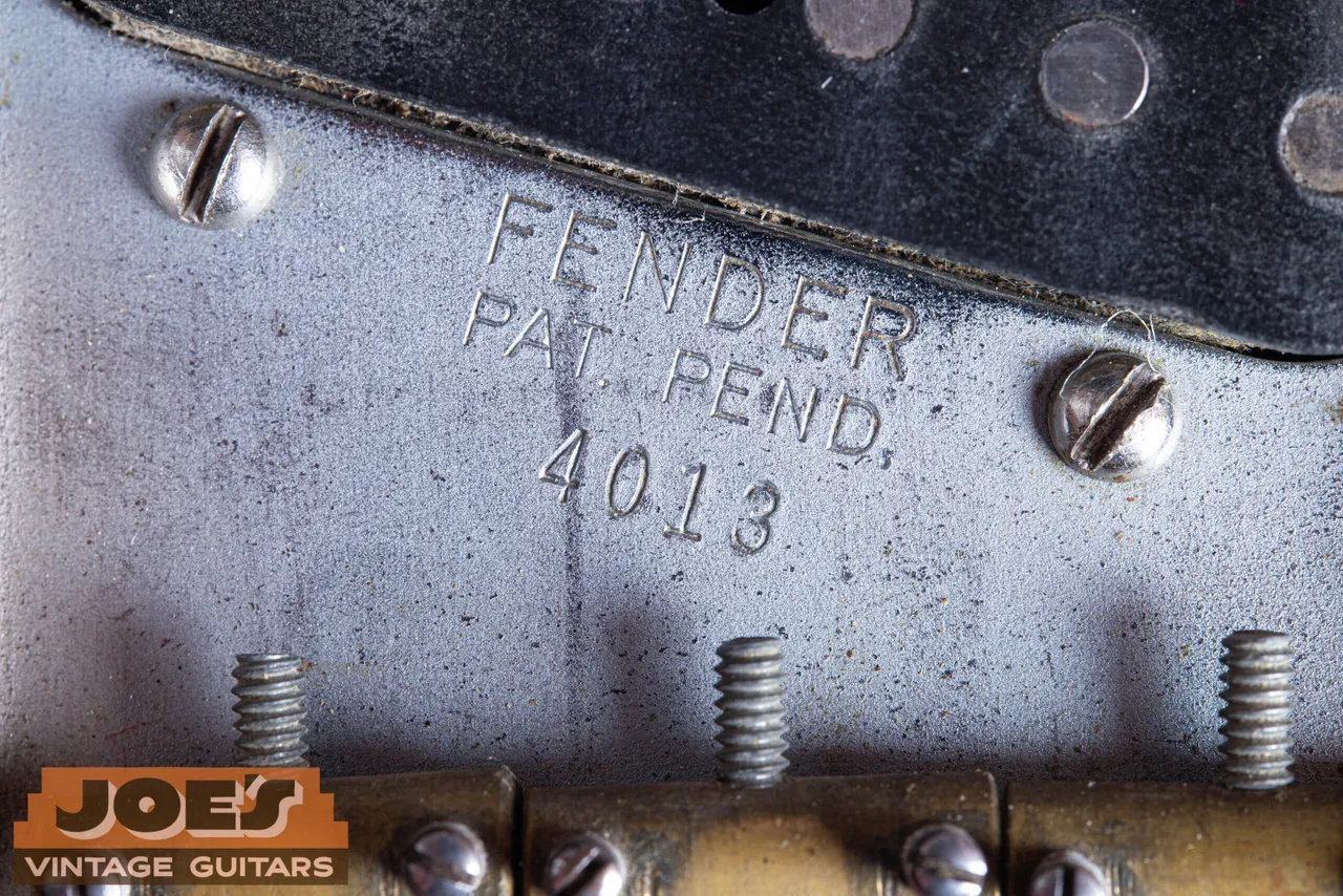 A Fender Telecaster bridge plate with the serial number stamped into the metal, 1950 to 1954