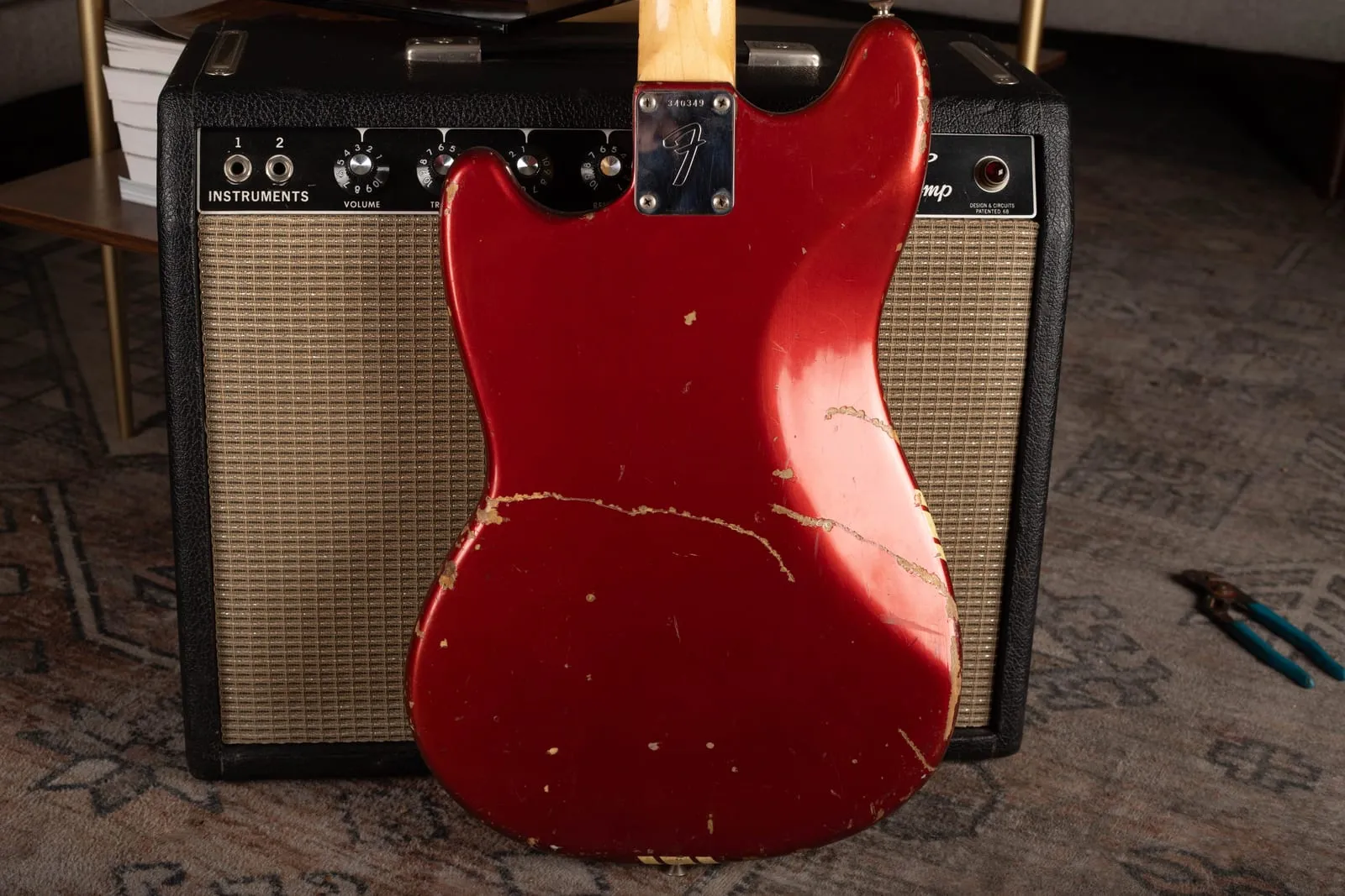 Back of a 1972 Fender Competition Mustang in Competition Red showing heavy finish wear and honest player condition.