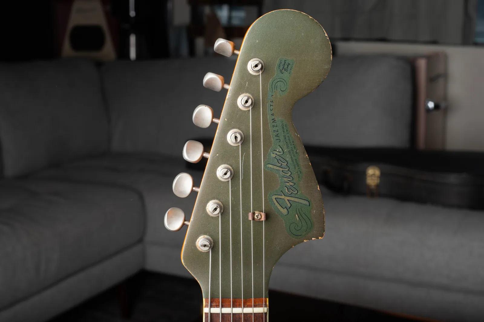 A Fender Jazzmaster custom color matching painted headstock with the gold transition logo and patent numbers on the decal