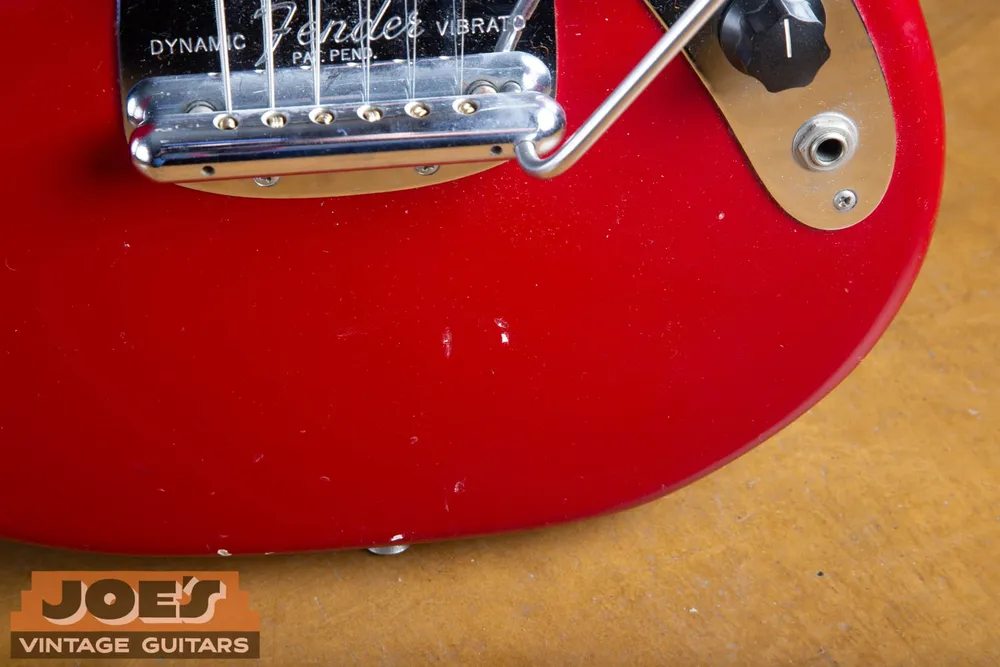 Close view of the Dynamic Vibrato plate on a 1965 Fender Mustang engraved Fender Dynamic Vibrato Pat. Pend.