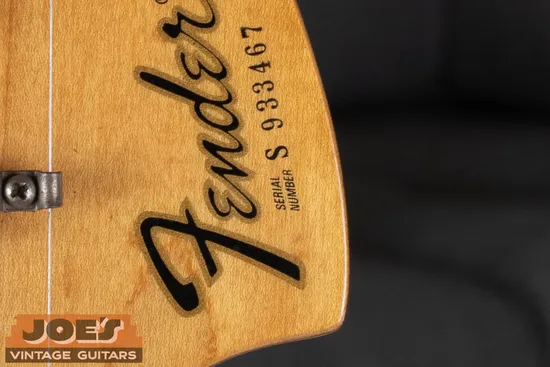 Fender S-prefix serial number on front of headstock: S indicates 1970s production, second digit gives the specific year
