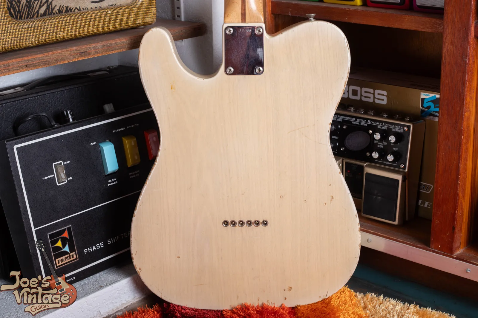 A string-through-body Fender Telecaster bridge, with the strings passing down through the body rather than anchoring at the plate