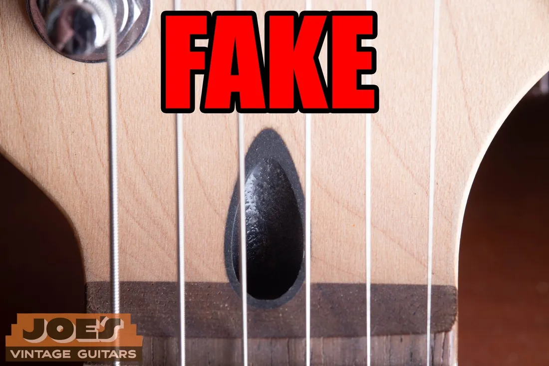 Black insert at the truss rod opening of a fake Fender-style neck