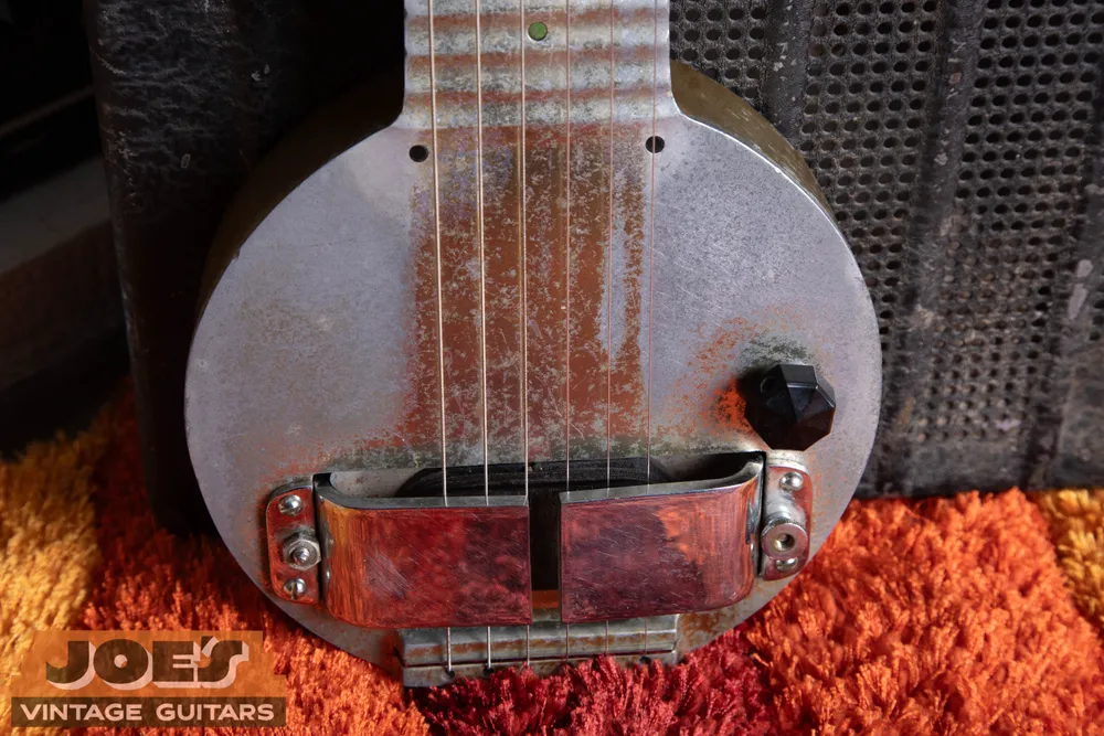 Horseshoe pickup wrapping over the strings of a Rickenbacker Frying Pan