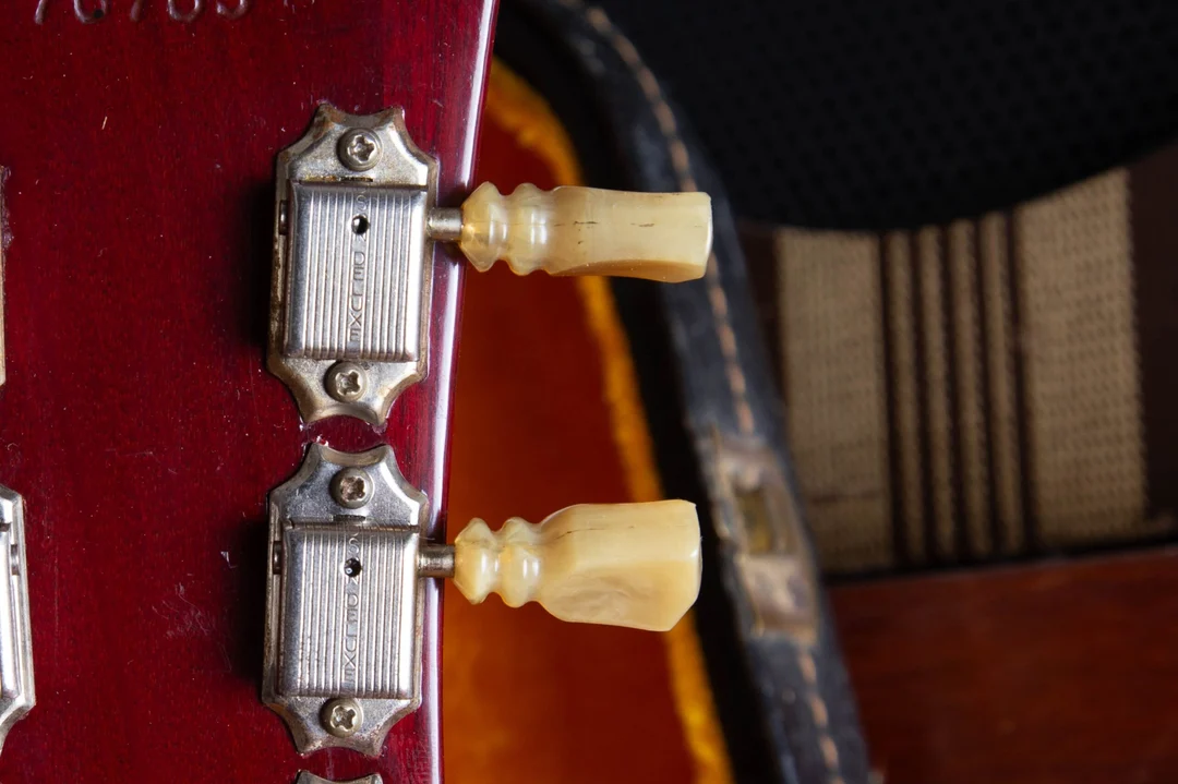 Close-up of double-ring Kluson tuner buttons on a vintage Gibson