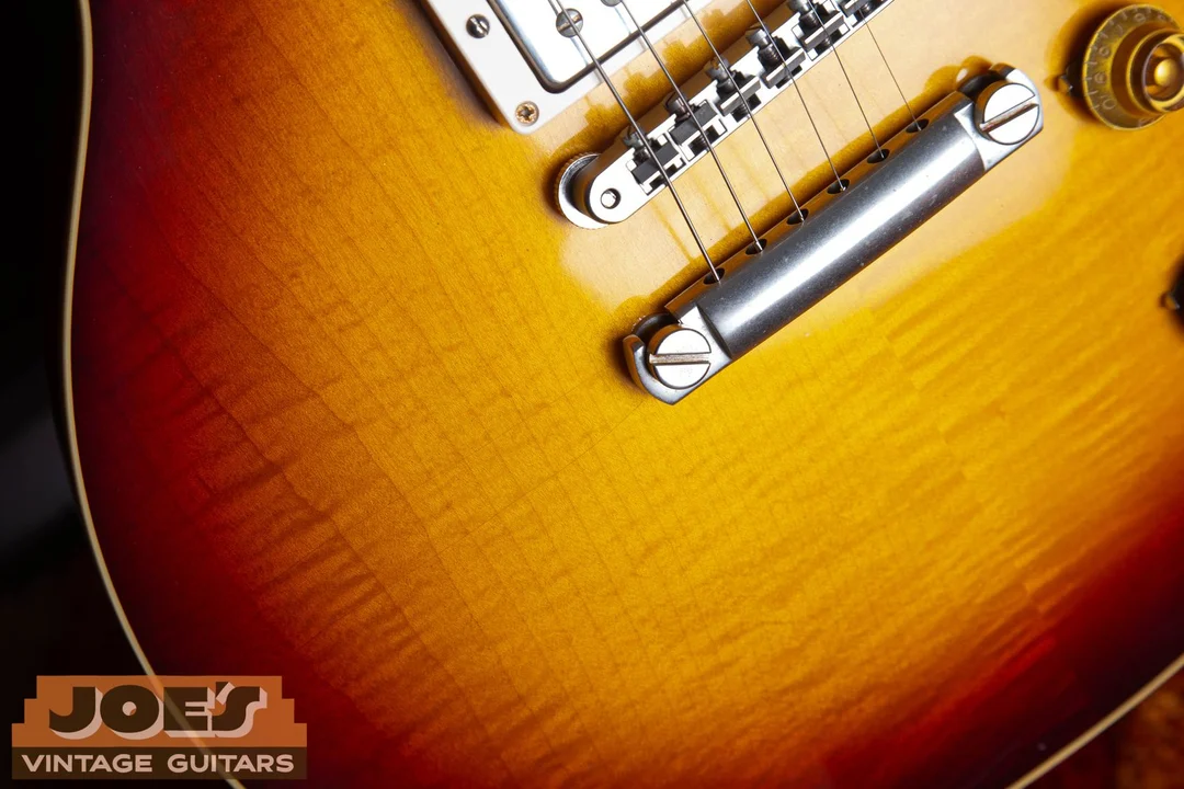 Close-up of a Gibson Les Paul Cherry Sunburst finish over figured maple