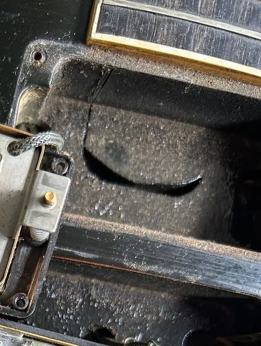 Long neck tenon extending into a Gibson Les Paul Custom neck pickup cavity
