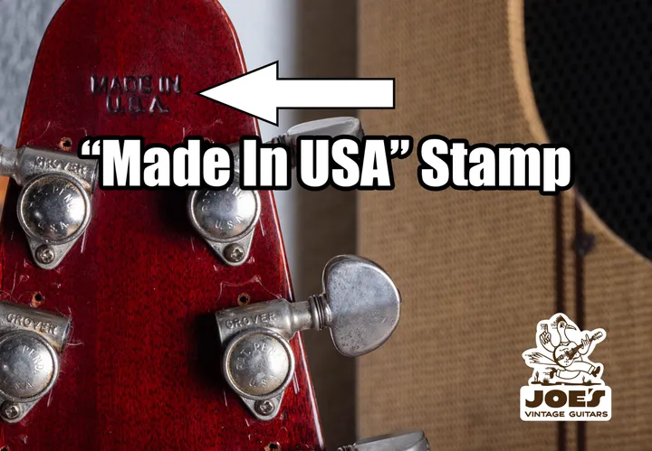 Close-up of the impressed Made in USA stamp on a vintage Gibson headstock