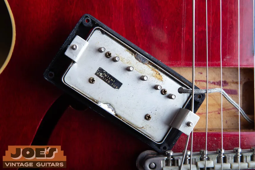 Original Gibson PAF pickup in a 1962 ES-335, with its worn Patent Applied For decal visible on the baseplate.
