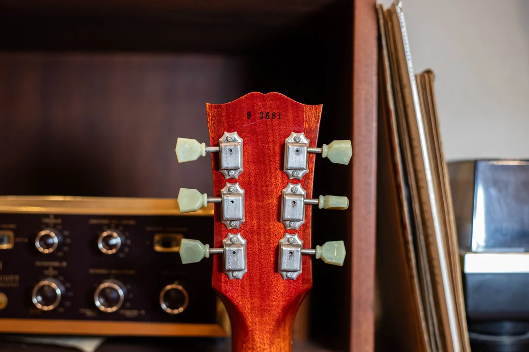 Ink-stamped reissue serial on the back of a Gibson Historic R9 Les Paul headstock