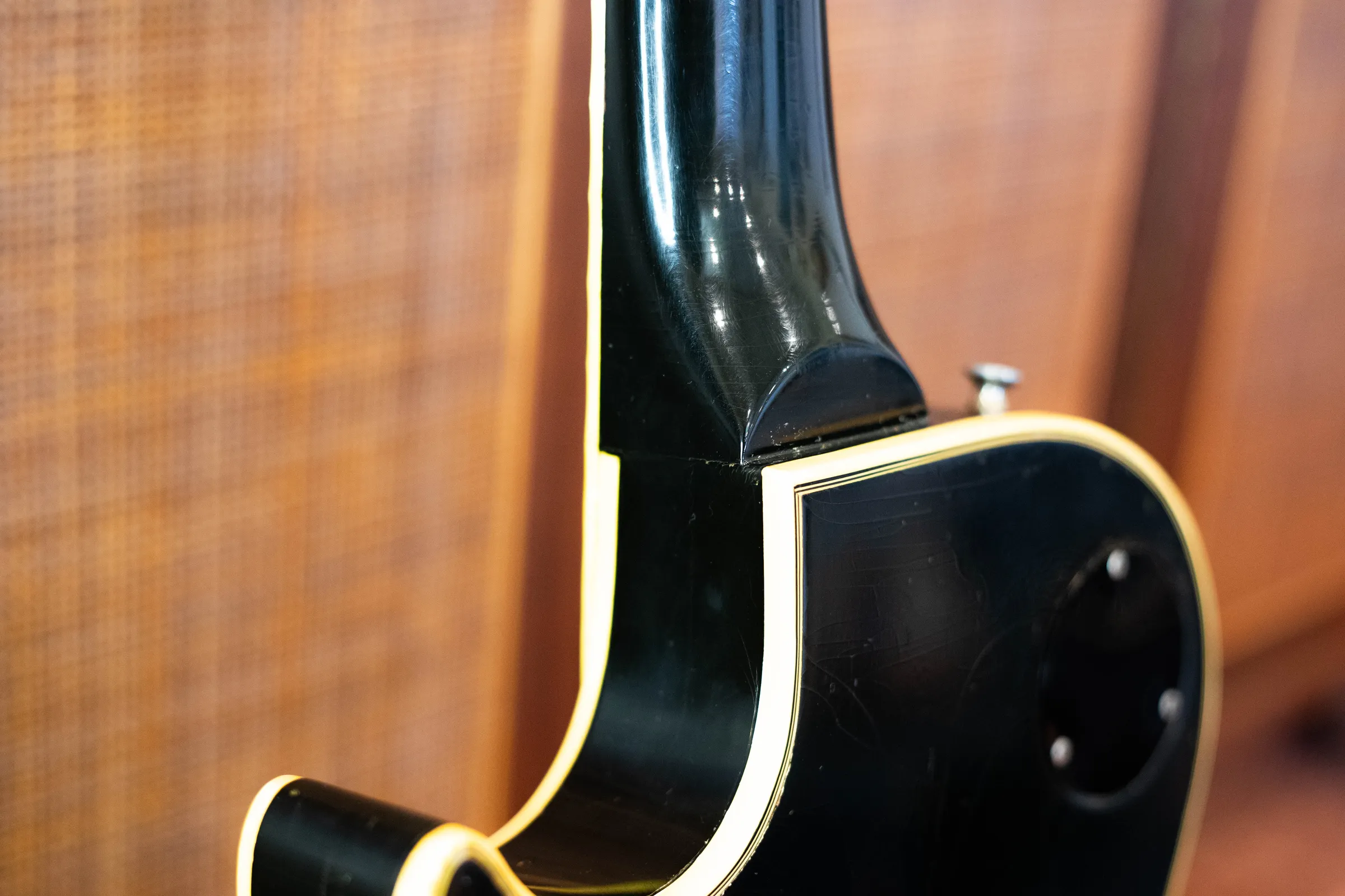 Close view of a 1970 Les Paul Custom neck heel and body binding