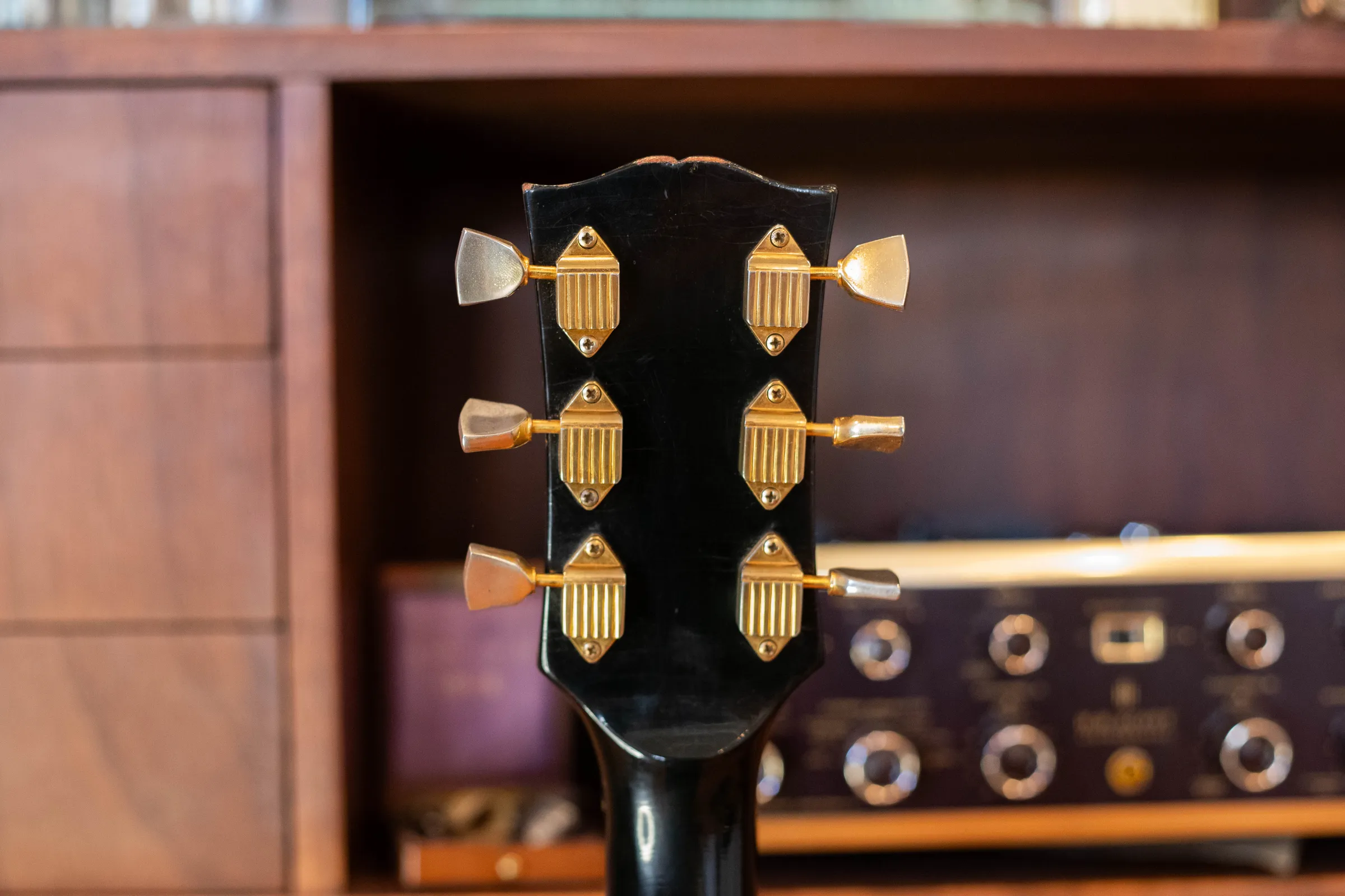 Rear headstock of a 1970 Les Paul Custom with gold ribbed waffleback tuners