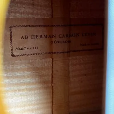 Interior label reading AB Herman Carlson Levin, Göteborg, Model 113, Made in Sweden