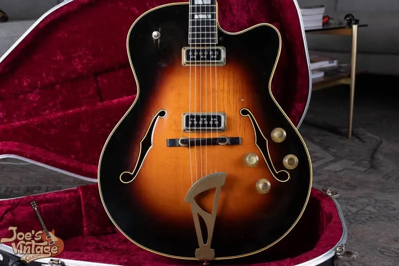 Sunburst Levin 320/M2 electric archtop with two pickups in its red-lined case