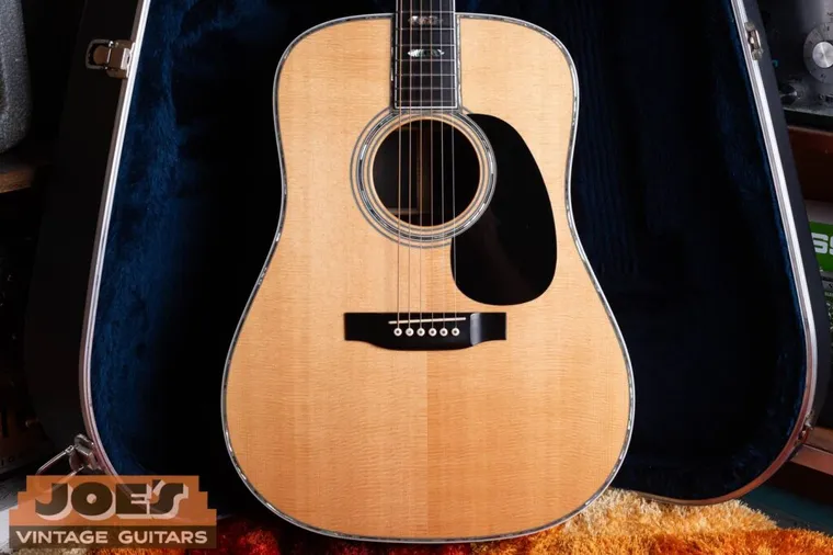 Martin D-45 dreadnought with pearl top border and fingerboard inlays