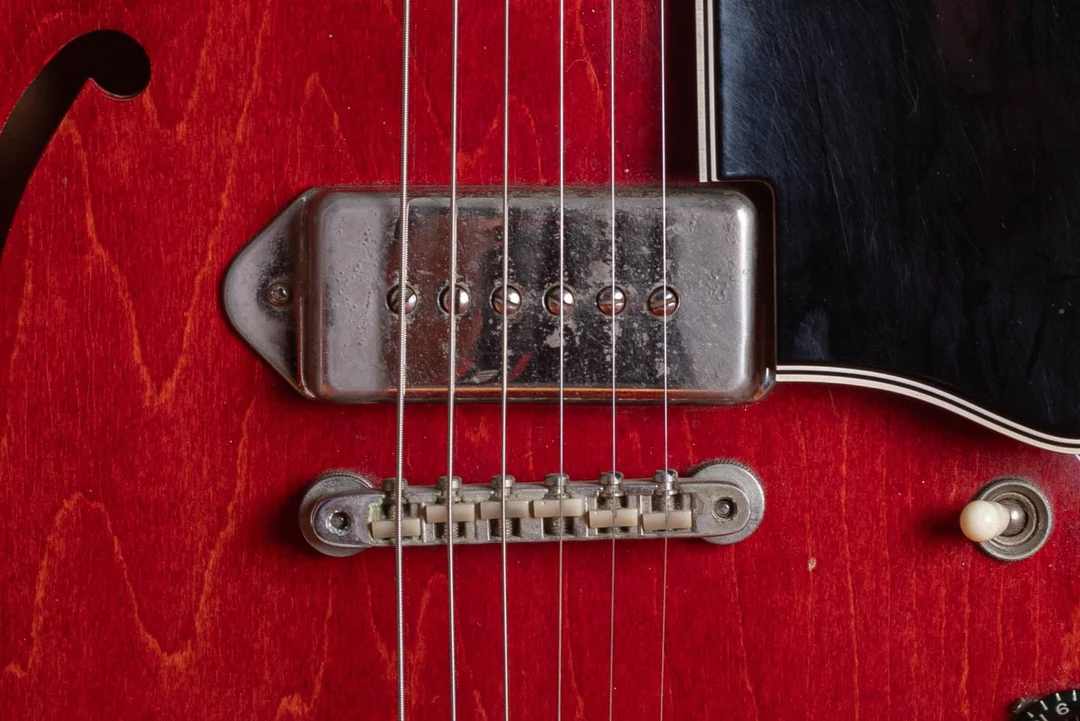 Metal dogear P-90 cover with six pole screws on a cherry ES-330