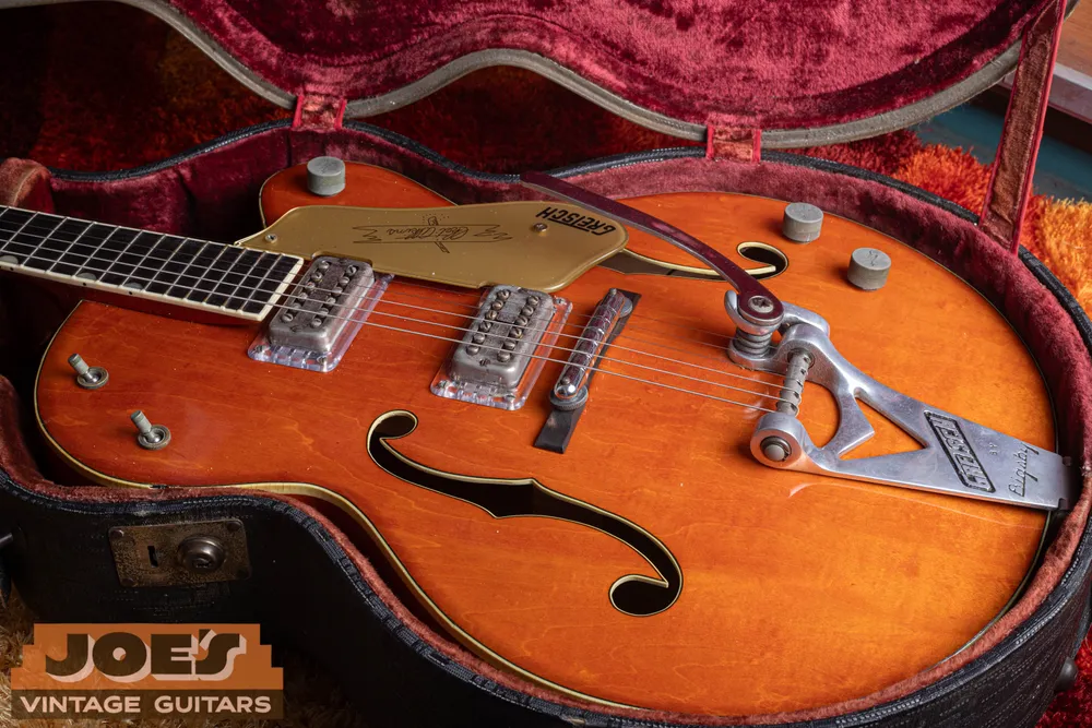 Bar bridge and Gretsch V-cut Bigsby on an orange single-cutaway 6120
