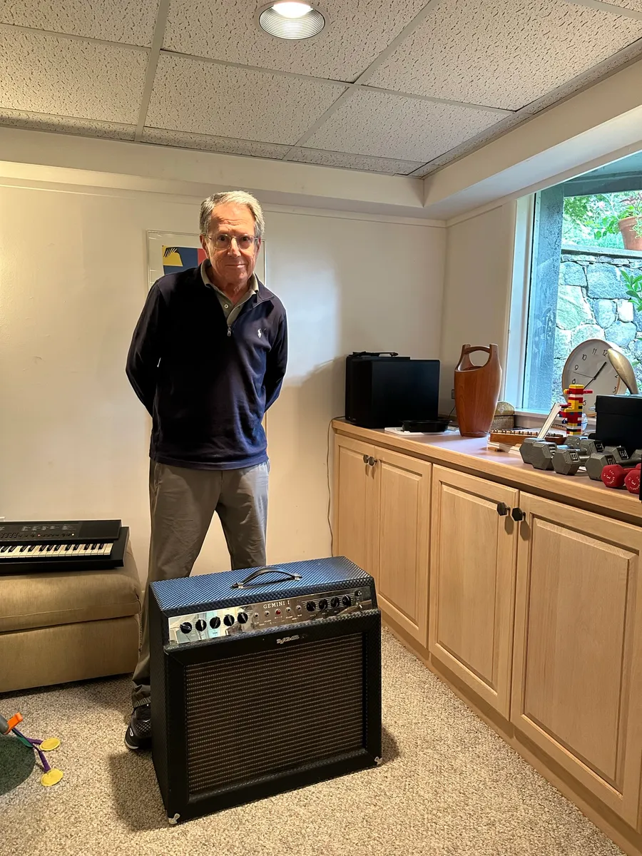 The original owner standing beside his 1966 Ampeg amplifier