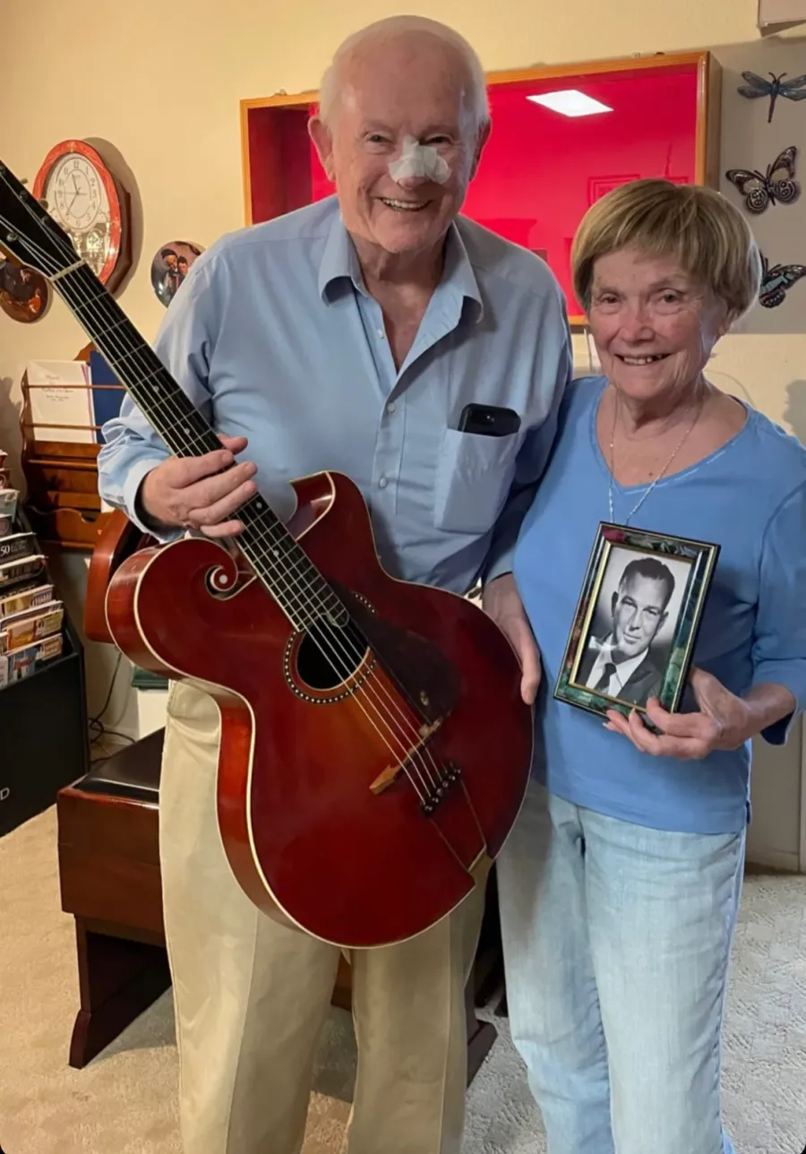 Scottsdale sellers with a Gibson Style O acoustic guitar