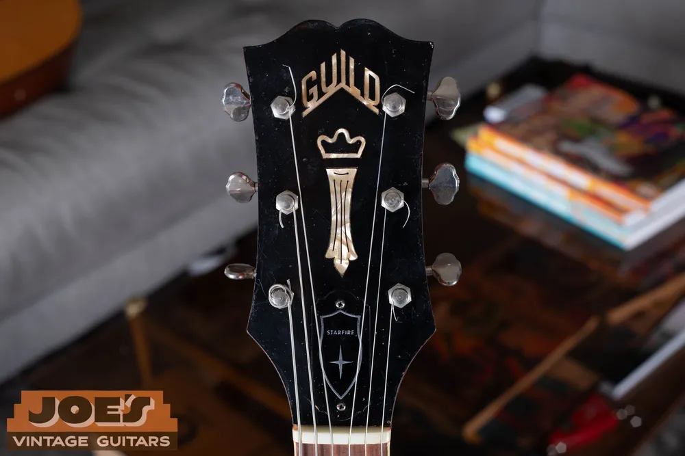 Guild crown and vertical inlay on a Starfire headstock