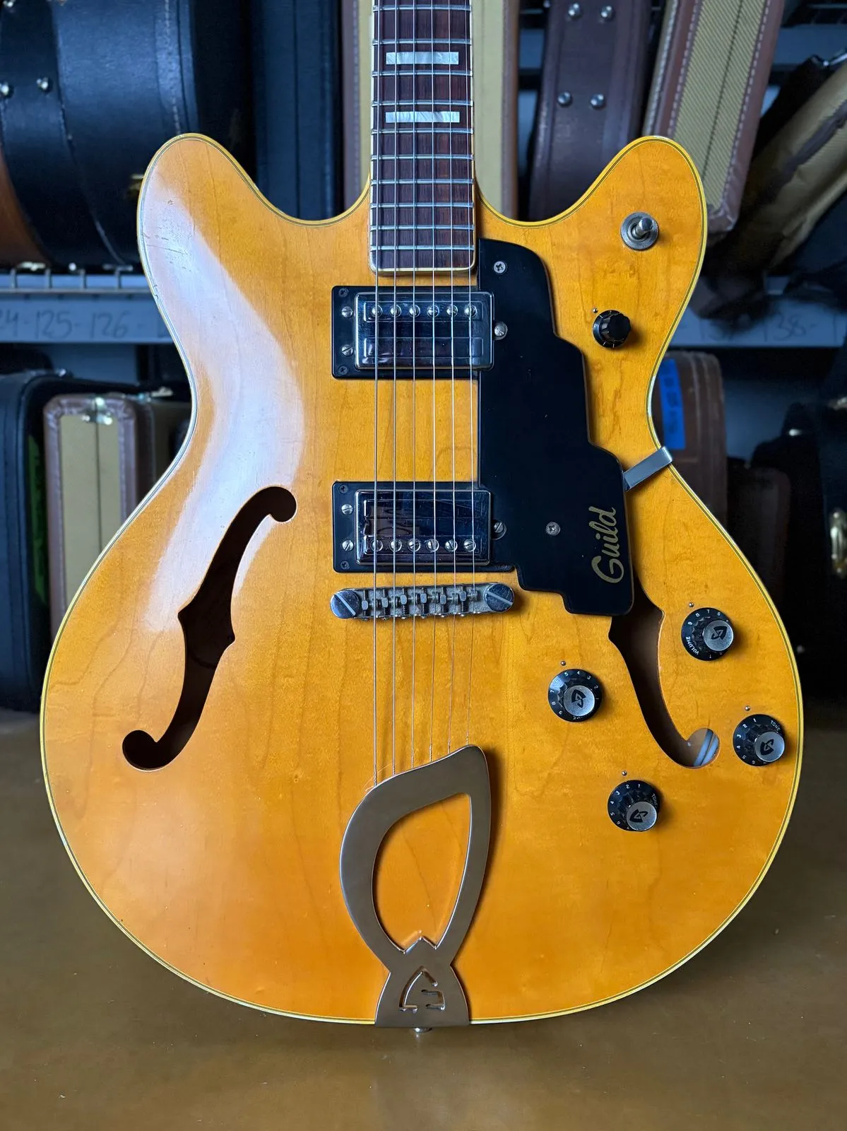 1977 Guild Starfire IV showing blonde double-cutaway body and harp tailpiece