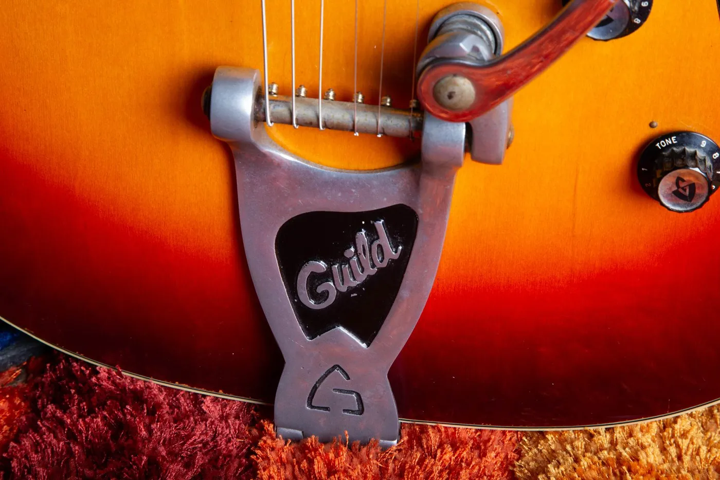 1966 Guild Starfire V showing Guild-branded factory Bigsby