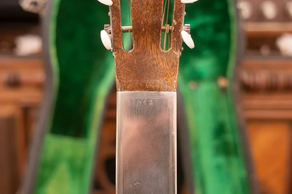 1928 National Style 3 Tricone showing serial 542 at the headstock joint