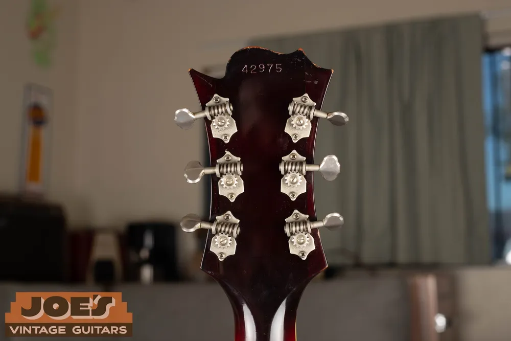 Serial number stamped above the tuners on a Guild Thunderbird