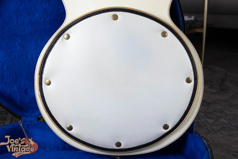 White back pad and gold binding on a White Falcon