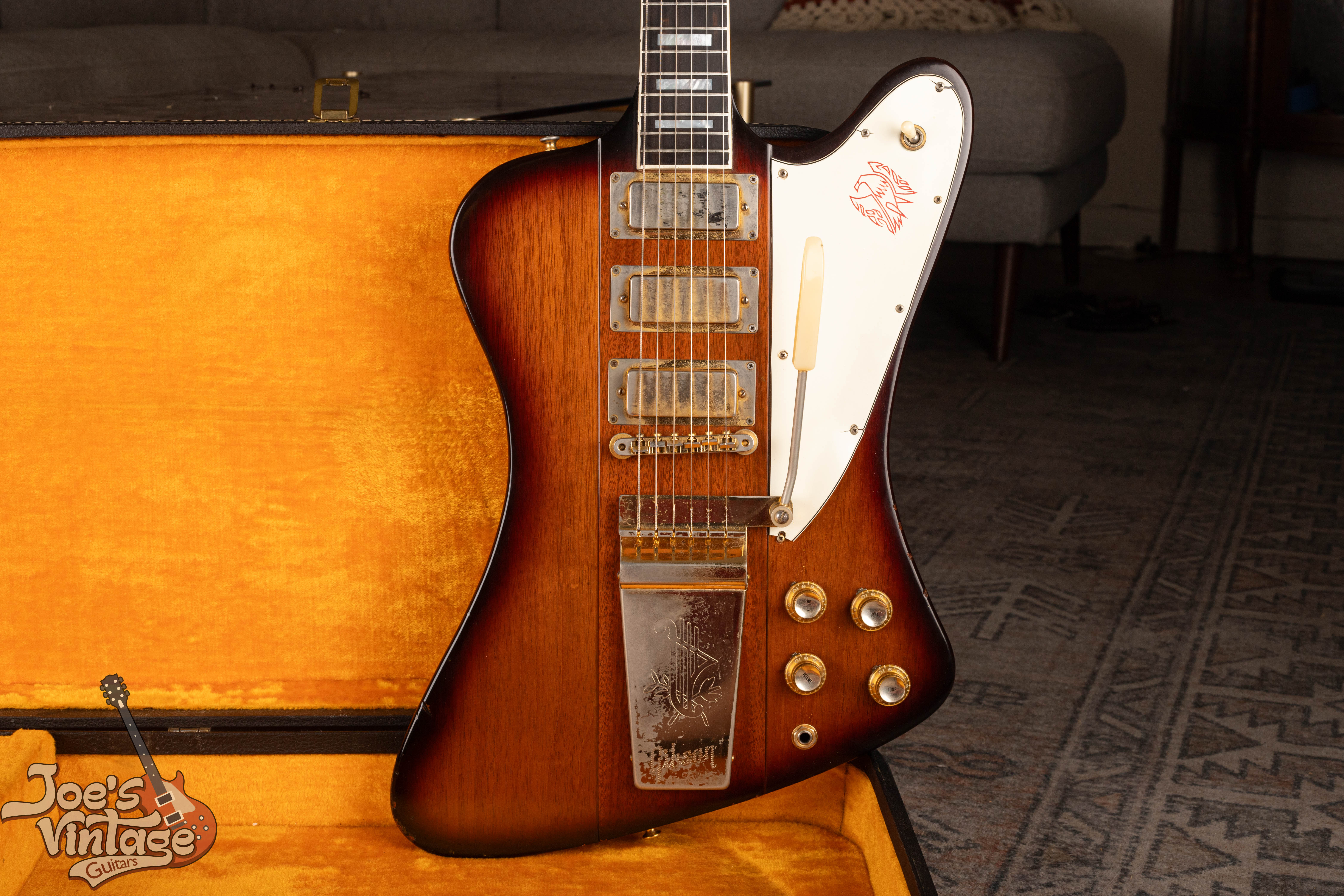 Close view of a reverse Firebird VII body, pickups, controls, bridge, and Lyre Vibrola