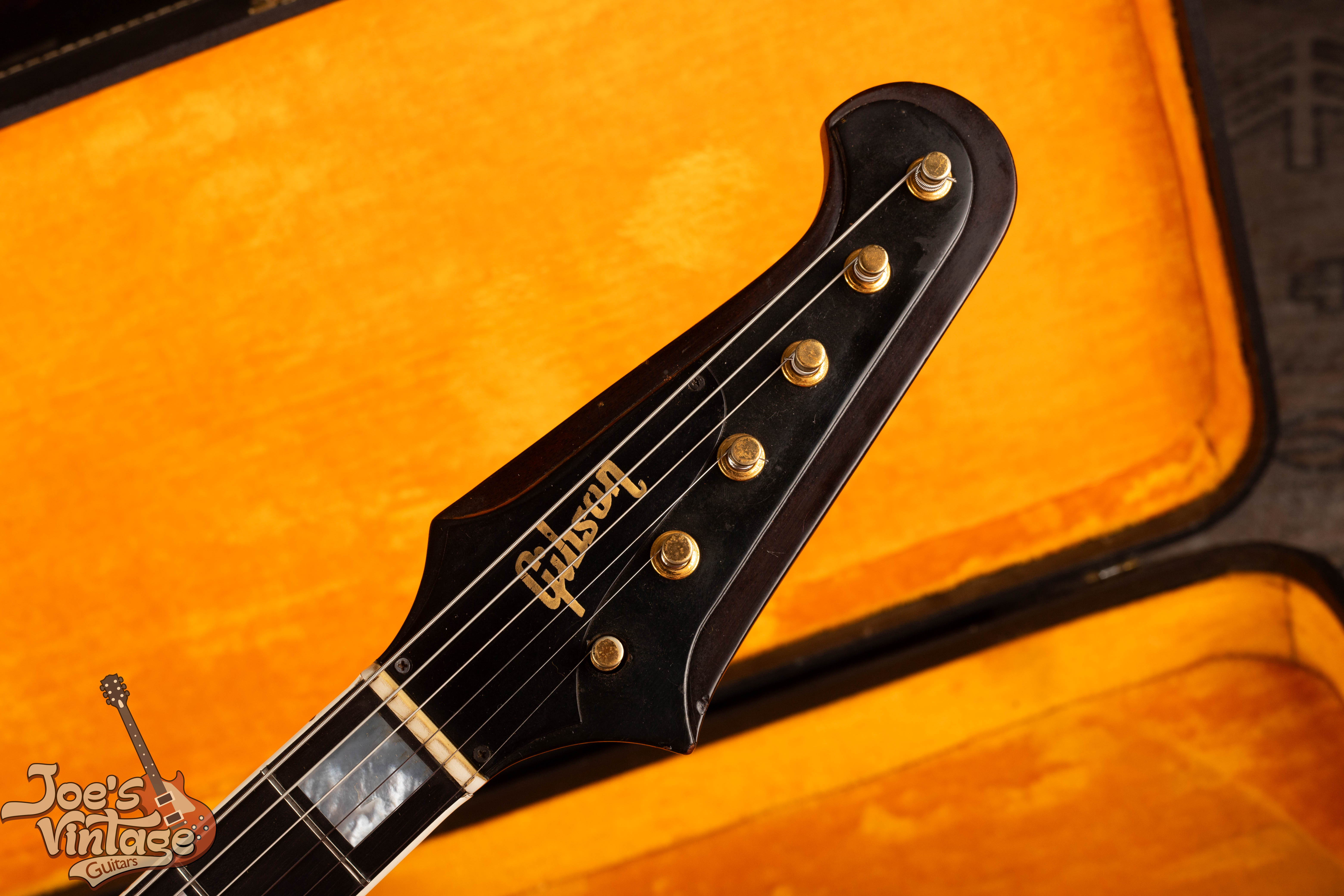 Reverse Firebird headstock with gold banjo tuner posts