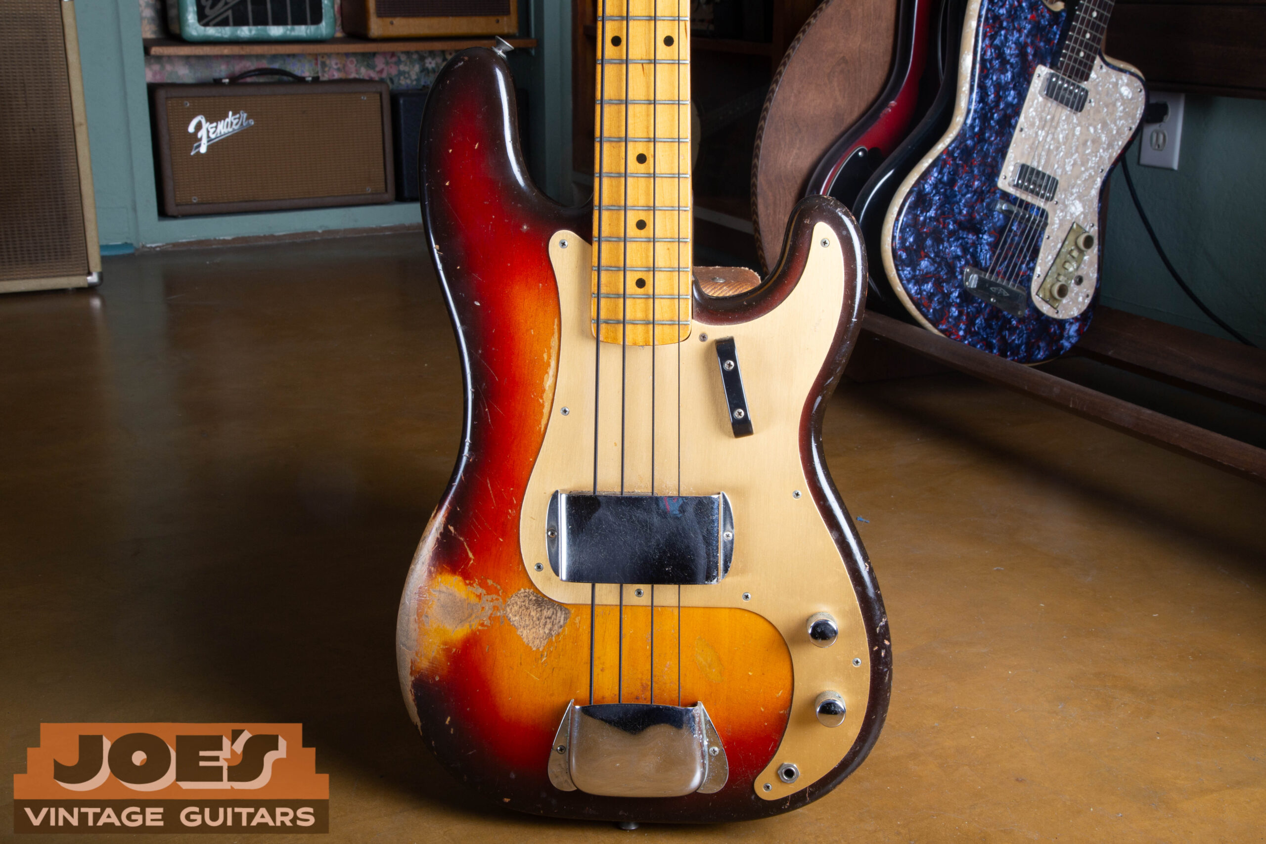 A 1959 Fender gold guard precision bass in Sunburst finish.