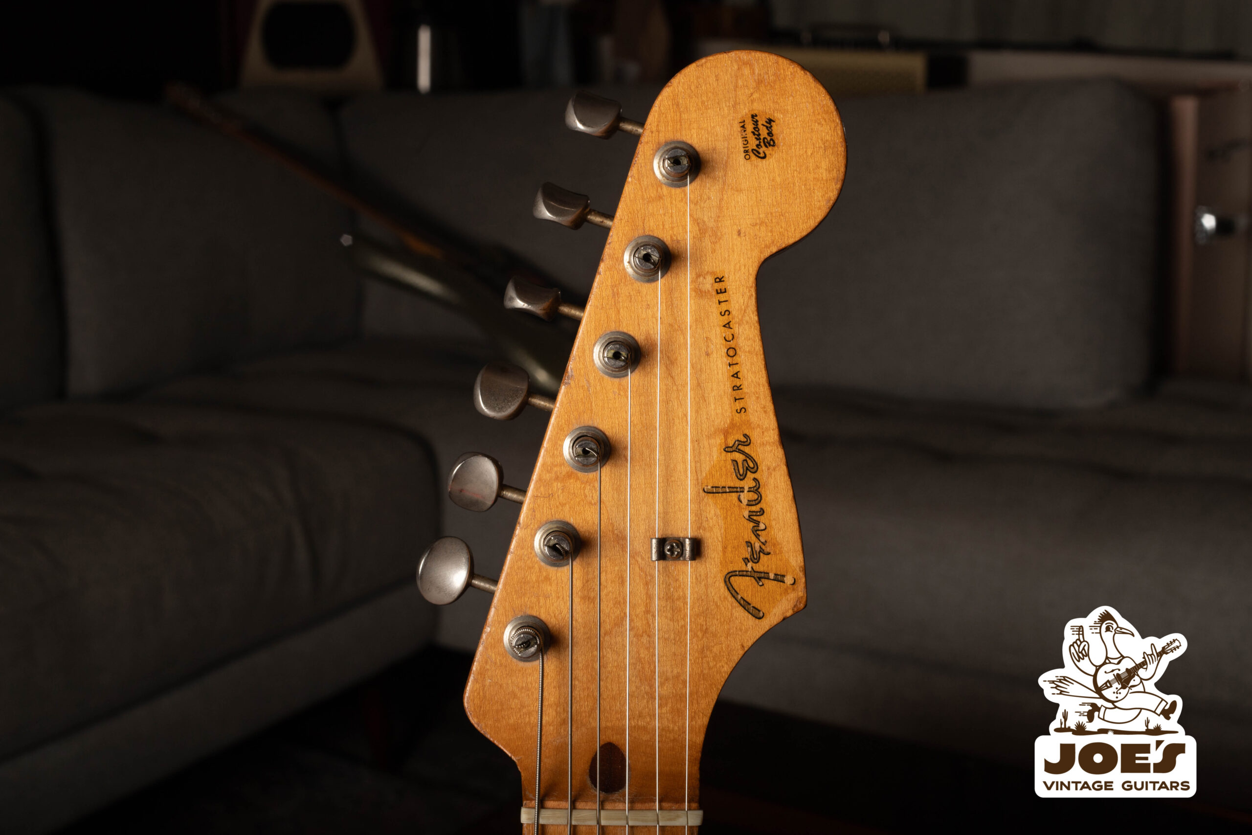 Head Of A Vintage Fender Stratocaster With Sunburst And Custom Finishes