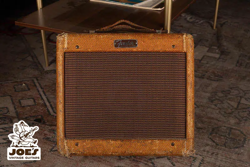 Vintage Fender amplifier with worn tweed covering, perfect for determining the Fender amplifier's age