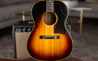 Vintage 1950s Gibson LG-2 acoustic guitar with large pickguard and original small rectangular rosewood bridge