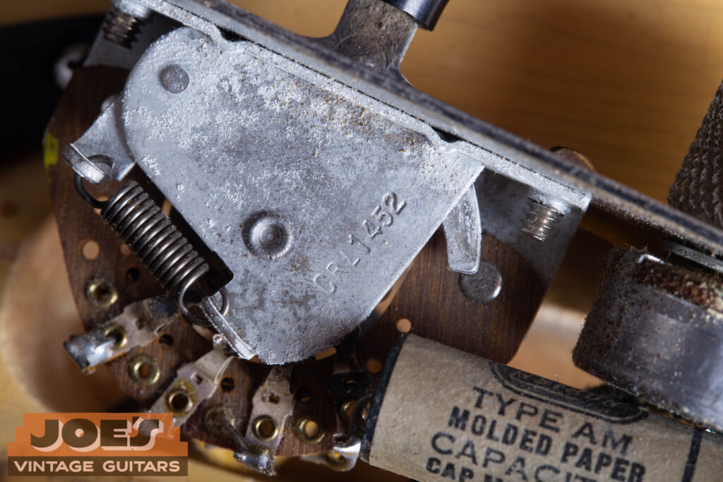 Internal view of a 1952 Fender Telecaster 3-way selector switch clearly showing the "CRL 1452" factory stamp.